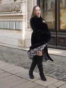 Model spinning in Sheard Deep Emerald Green Mink Fur Coat M Excellent, showcasing bold zebra-print lining and elegant fur movement.