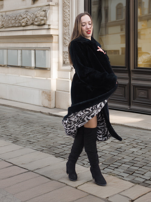 Model spinning in Sheard Deep Emerald Green Mink Fur Coat M Excellent, showcasing bold zebra-print lining and elegant fur movement.