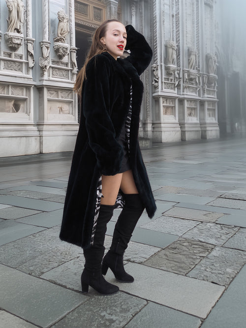 Model poses in Sheard Deep Emerald Green Mink Fur Coat M Excellent, highlighting its sleek silhouette and luxurious mink fur for cold-weather style.