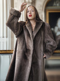 Woman wearing a fur coat in an elegant interior setting