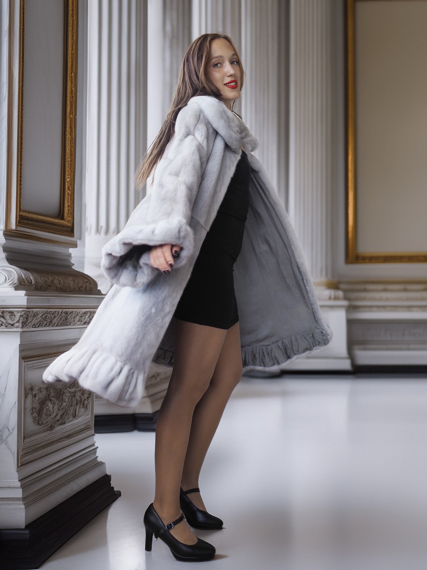 Woman wearing a fur coat in an elegant interior setting