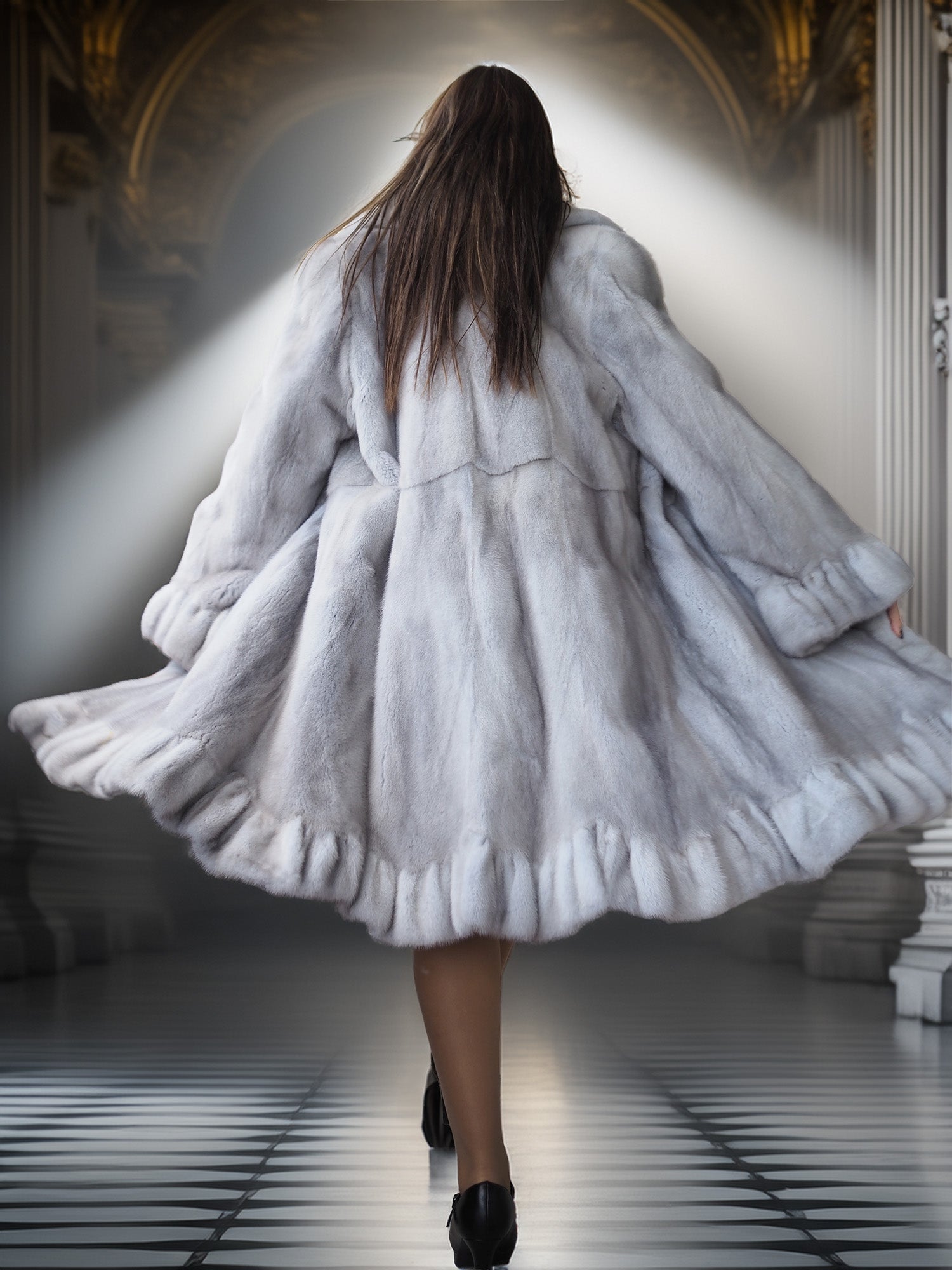 Person wearing a long, light-colored coat in an elegant interior setting