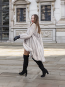 Model twirls in Sapphire Grey Mink Fur Coat S Petit Excellent, showcasing its luxurious drape and winter-ready elegance.