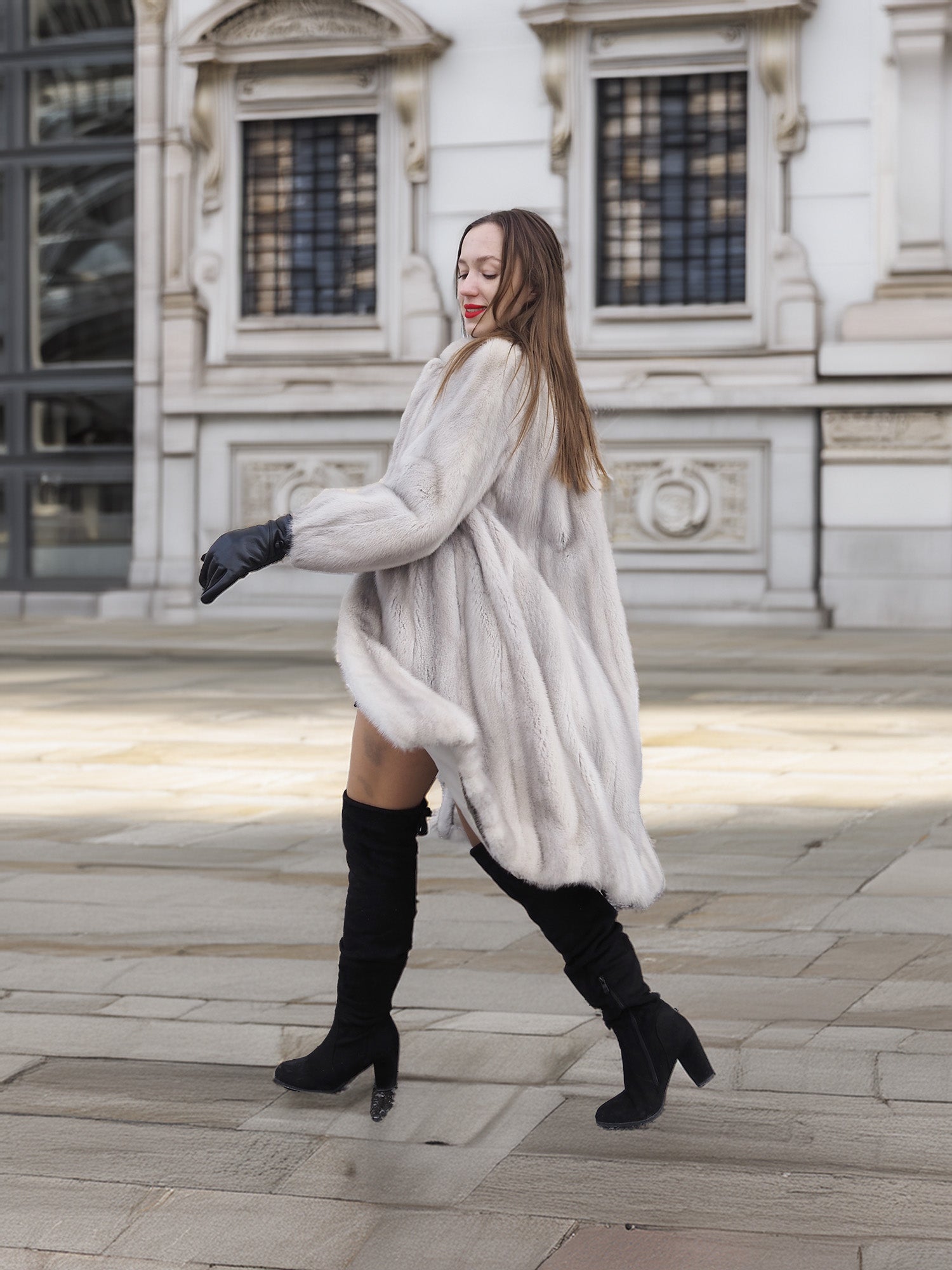 Model twirls in Sapphire Grey Mink Fur Coat S Petit Excellent, showcasing its luxurious drape and winter-ready elegance.