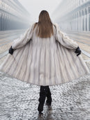 Back view of Sapphire Grey Mink Fur Coat S Petit Excellent spread wide, showcasing its voluminous design and natural fur texture.