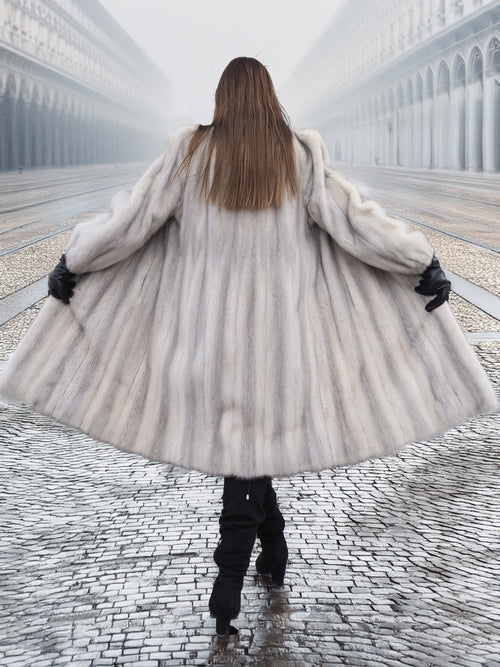 Back view of Sapphire Grey Mink Fur Coat S Petit Excellent spread wide, showcasing its voluminous design and natural fur texture.