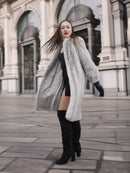 Model twirls in Sapphire Grey Mink Fur Coat S Petit Excellent, showcasing its flowing silhouette and luxurious fur finish.