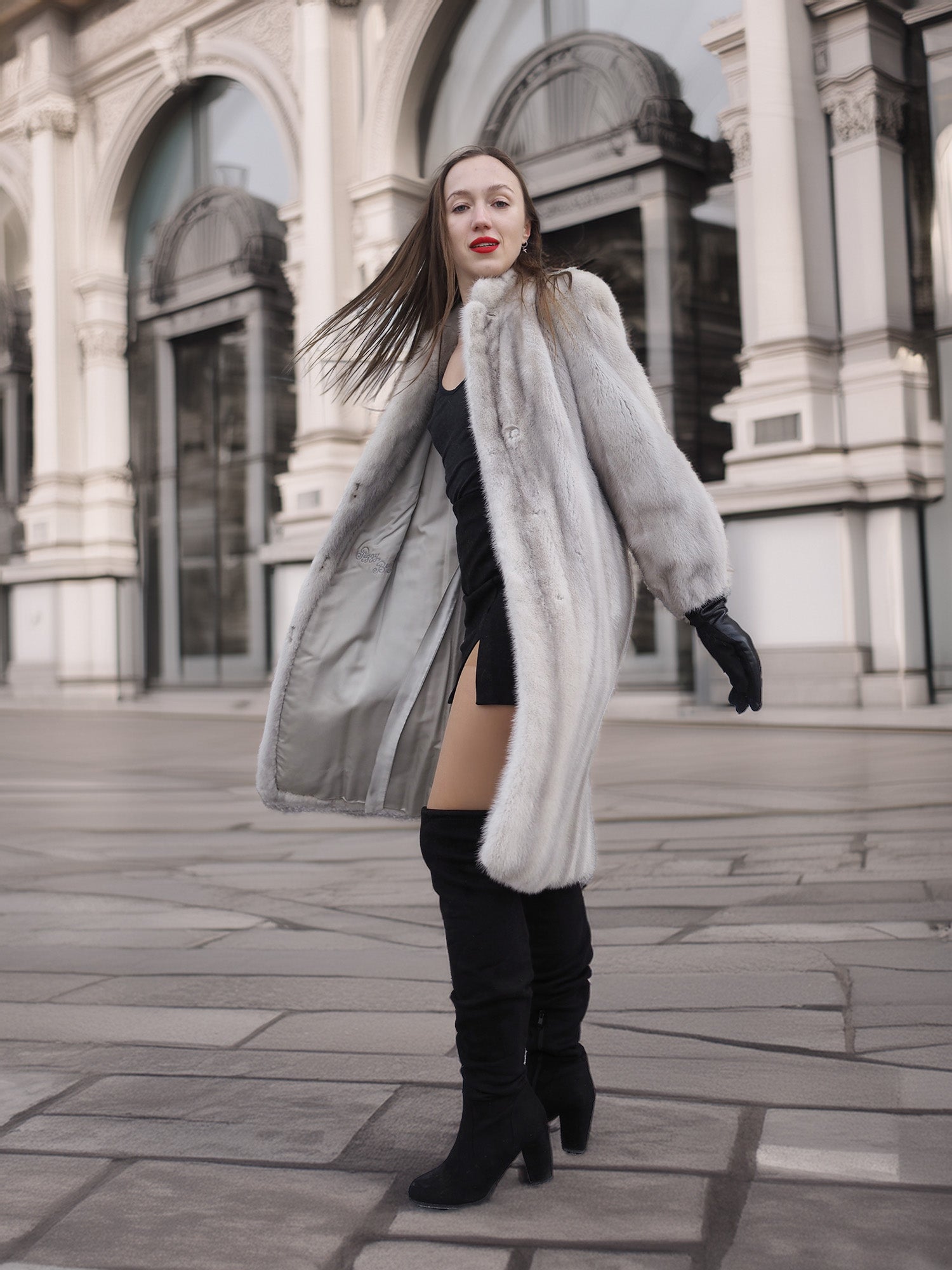 Model twirls in Sapphire Grey Mink Fur Coat S Petit Excellent, showcasing its flowing silhouette and luxurious fur finish.