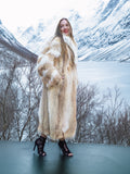 Coyote fur coat with white fox trim in snowy forest