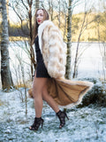 Coyote fur coat with white fox trim in snowy birch forest