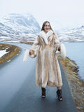 Coyote fur coat with white fox trim on mountain road