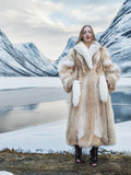 Coyote fur coat with white fox trim in snowy valley