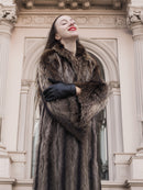 Model wearing Canadian Raccoon Fur Coat in silver tips, showcasing natural fur detail and luxury outerwear appeal in winter setting.