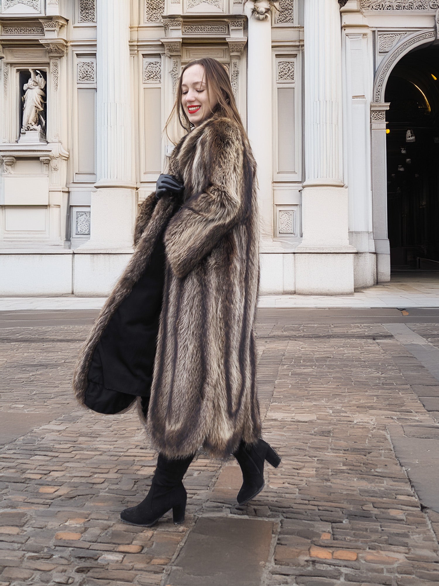 Side pose in Canadian Raccoon Fur Coat with silver tips, highlighting scalloped hem and plush fur for winter outerwear.
