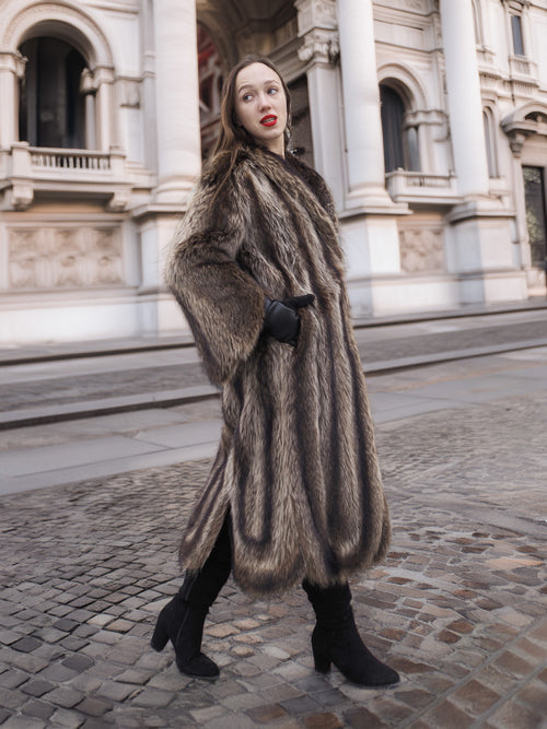 Side profile of Canadian Raccoon Fur Coat in silver tips, highlighting natural fur texture and elegant winter fashion silhouette.
