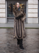 Canadian Raccoon Fur Coat in silver tips worn with black gloves and boots, perfect for stylish and warm winter fashion.