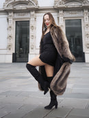 Canadian Raccoon Fur Coat in silver tips styled with black mini dress and thigh-high boots, blending luxury with modern fashion.