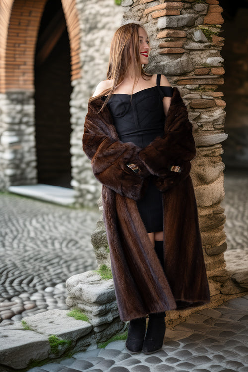 Dark brown mink coat with wide collar and belt; full length fur with curved hem