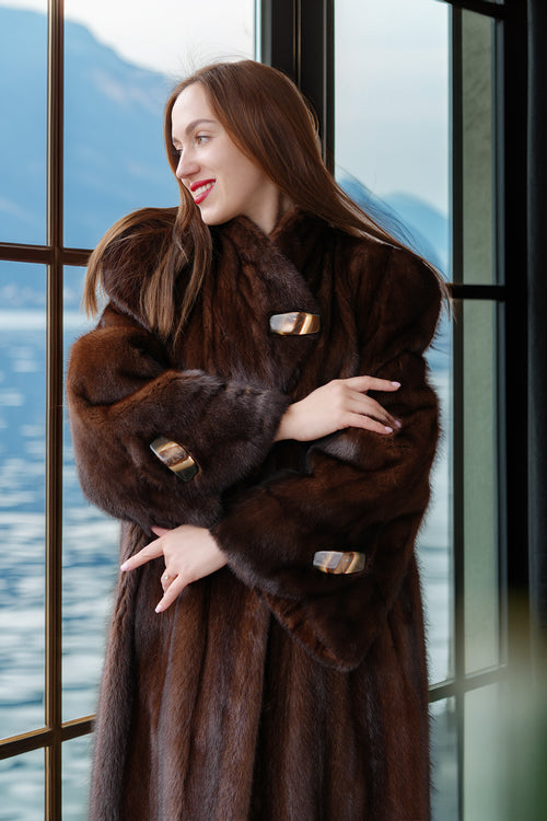 Close view of rich brown mink coat collar and sleeves with metal clasp accents