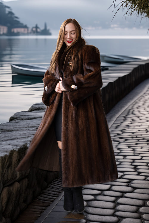 Long rich brown mink coat with wrap-style front, mid-calf length and side slit