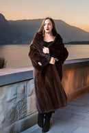 Demi-mink coat in rich brown tone with wide collar, long hem and cuff buttons