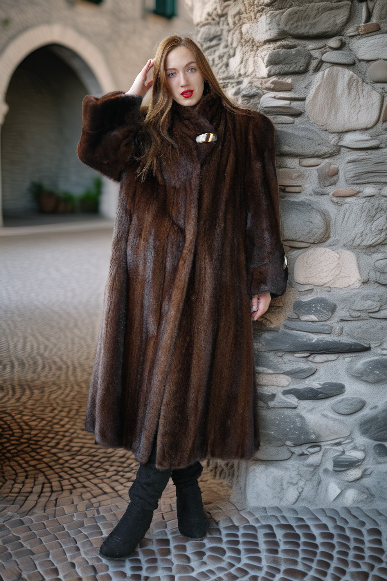 Rich brown mink coat with high collar, decorative metal clasp, and voluminous sleeves