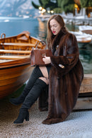 Long rich brown mink coat, belted waist, front buttons/clasp detail at the neckline
