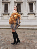 Fashionable gray and red fox fur coat, perfect for winter styling. A statement piece for those who love luxury fur outerwear.