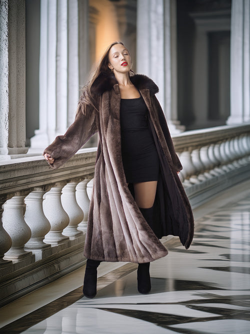 Woman in a long brown fur coat standing in an elegant hallway with columns.