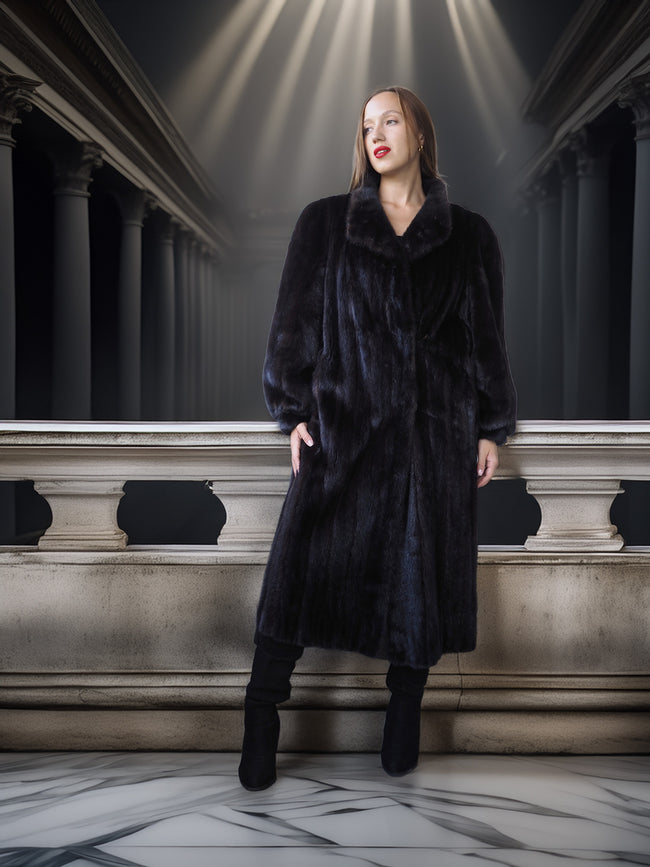 Woman wearing a long black fur coat in an elegant interior setting