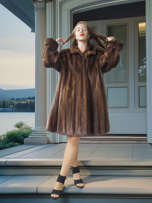 Woman in a fur coat standing on a porch with a scenic background