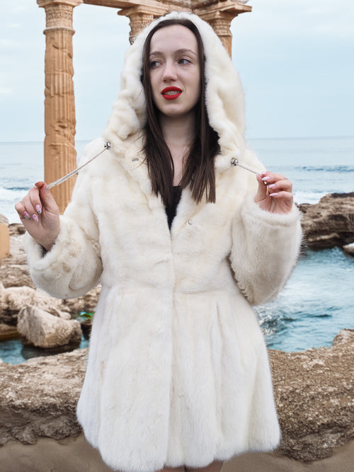Beige Pearl Mink Fur Coat with hood, offering chic warmth and elegance. Features hook-eye closure, satin lining, and pockets for a luxurious touch.