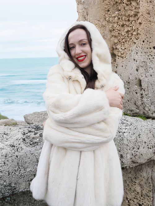 Beige Pearl Mink Fur Coat with hood, offering chic warmth and elegance. Features hook-eye closure, satin lining, and plush mink texture for luxury.