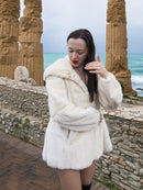 Beige Pearl Mink Fur Coat with hood, offering chic warmth and elegance. Features hook-eye closure, satin lining, and pockets for a luxurious feel.