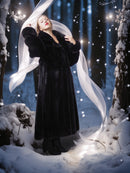 Person in a long black coat with a white veil in a snowy forest