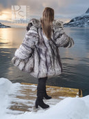 Silver-gray long fur jacket with voluminous shoulders and full sleeves, stroller length