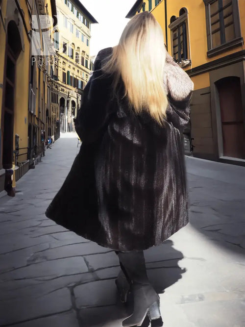 Black mink coat with light fur collar, back view in street setting