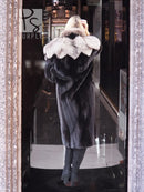 Black mink coat shown from back with light gray fox-fur cape collar