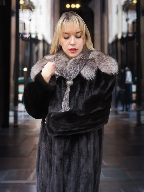 Black mink coat with light gray fox-fur cape collar, close-up of front neckline