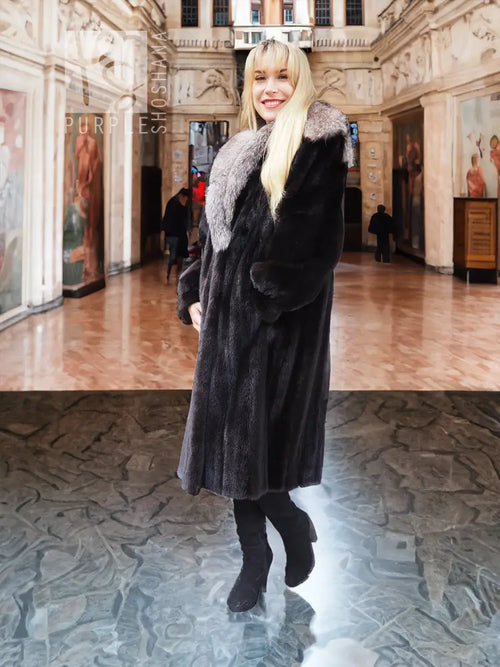 Black mink coat with light gray fox-fur cape collar, three-quarter front view