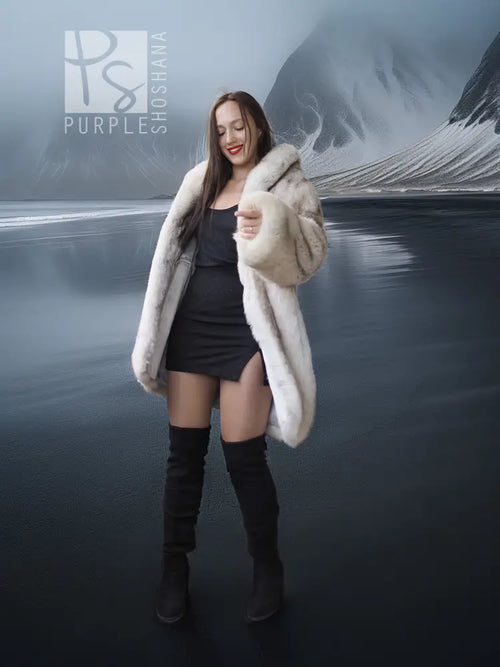 Light cream fur jacket with hood and open front, model holding collar