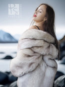 Light cream fur jacket with thick hood, close-up across the shoulders
