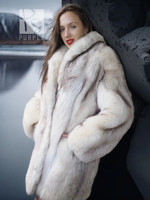 Light cream fur jacket close-up with hood and textured sleeve detail