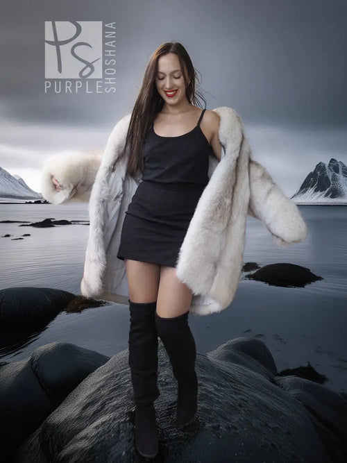Light cream hooded fur jacket with open front and long sleeves on model