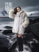 Light cream fox-fur jacket with thick collar and mid-length cut, open front.
