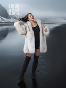 Light cream fox-fur jacket with open front and wide sleeves, worn over black.