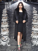 Black long fur coat with open front, shawl collar, and textured sleeves