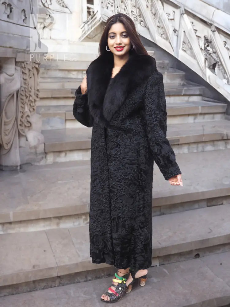Black long fur coat with fuzzy shawl collar, textured body, side stance