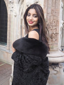 Long lambswakara broadtail coat, black with plush fur collar and hood (front view)