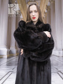 Black mink fur coat with plush high collar and thick cuffs, front crossed-arm view